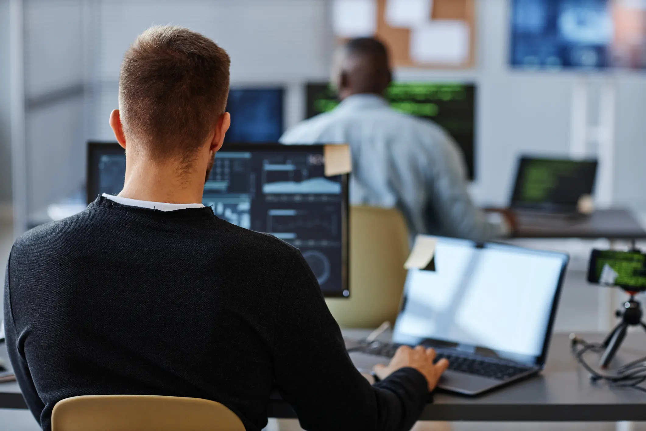 A male staff working at Silixa office